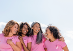 image shows women celebrating breast cancer month